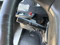 Close-up of the control lever on the steering column of a 2008 Workhorse W62 showing settings for headlights and windshield wipers