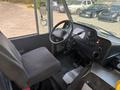 Interior view of a 2018 Ford Econoline showing the driver's seat dashboard and controls