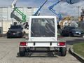 2023 RAM Promaster 3500 chassis with a transparent tarp covering the cabin area showcasing the vehicle's cargo capabilities