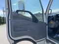 The image shows the door panel of a 2014 Hino 195 truck featuring a grey interior with a handle and speaker placement