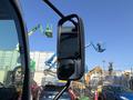 2018 Hino 195 side mirror reflecting surrounding machinery and equipment