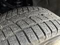Close-up of a tire tread showcasing detailed patterns and grooves on a 2018 Chevrolet Colorado tire designed for traction and durability