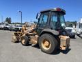 A 2011 Case 570 MXT loader backhoe featuring large tires a cabin with a glass enclosure and a front-loading bucket