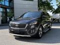 A 2017 Kia Sorento in a metallic gray color with a distinctive front grille and chrome accents parked at a dealership