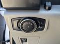 Control dial panel for lights and settings in a 2019 Ford F-150 with a circular knob and various symbols for headlight and interior light adjustments
