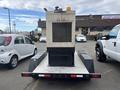 A 2005 Katolight SED60FPJ4 generator with a large front grille and yellow warning light on top is positioned on a trailer with a flatbed design