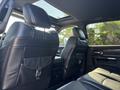 Interior view of a 2018 RAM 3500 with black leather seats and a sunroof showing the rear seat area and console