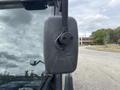 Close-up of a 2019 Madvac LS175 with a focus on the black side mirror featuring a rounded shape and integrated connections