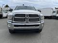 A 2015 RAM 2500 truck with a prominent chrome grille and sturdy front bumper visible in the foreground