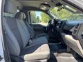 Interior view of a 2019 Ford F-150 featuring gray cloth seats and a dashboard with controls and a steering wheel visible