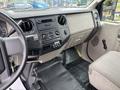 Interior view of a 2010 Ford F-550 Super Duty featuring a dashboard with controls and a steering wheel