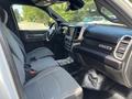 Interior view of a 2021 RAM 5500 featuring gray cloth seats and a modern dashboard with a touch screen display