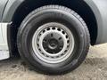 A close-up view of a 2020 Mercedes-Benz Sprinter 2500 tire featuring a silver wheel rim and black tire with a round design and Michelin branding