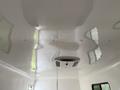 The ceiling of a 2025 Shuttle Office with smooth white surface and a central air conditioning unit