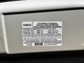 Label from a 2014 Ford Econoline detailing important engine information and vehicle emission control regulations