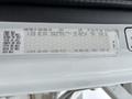 A weight rating label showing the specifications for a 2013 Freightliner 114SD with information on front, rear, and axle limits