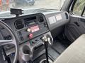Interior view of a 2013 Freightliner 114SD dashboard featuring controls for air conditioning and gear shift with various gauges and labels