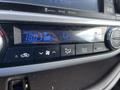 Close-up of the climate control panel in a 2018 Toyota Highlander displaying temperature settings and fan speed controls