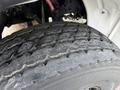 Close-up of a worn tire on a 2015 Freightliner M2 showing visible tread wear and textured surface