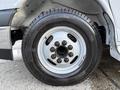 A close-up view of a silver wheel and tire from a 2019 Chevrolet Express featuring a six-bolt pattern and a black tire with visible tread
