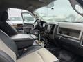 Interior of a 2011 Dodge Ram 5500 with a black and gray seating layout featuring a central console and dashboard controls