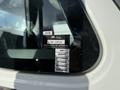 A 2010 International 4300 truck with a sticker displaying the British Columbia certificate of approval and months of expiration dates for registration