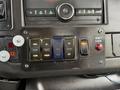 Dashboard control panel of a 2019 Chevrolet Express featuring various buttons for lights and functions