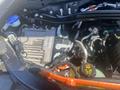 Engine compartment of a 2020 Ford Explorer showcasing various components including an engine control unit and cooling system parts