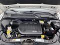 The engine compartment of a 2014 RAM Cargo Van showing a 3.6L V6 engine with various components including the air intake and battery