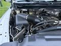 Close-up of the engine compartment of a 2018 RAM 5500 showing the air intake system and various engine components