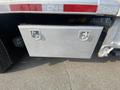 A gray storage box with two handles mounted on the back of a 2016 RAM 5500 truck