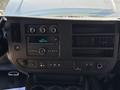 Dashboard of a 2019 GMC Savana featuring controls for air conditioning audio system and additional input options