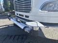 A 2022 Freightliner M2 106 front bumper with a chrome grille and large headlights featuring a hitch attachment and protective cover at the center