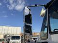 A close-up view of the side mirror of a 2017 International 4300 truck showing its reflective surface and chrome finish