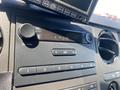 Dashboard of a 2015 Ford F-450 SD featuring a radio display and air conditioning controls