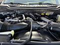 Close-up view of the engine compartment of a 2019 Ford F-550 featuring various components including hoses pipes and the engine block