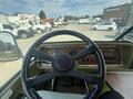 Interior view of a 1976 GMC Motorhome showcasing the steering wheel dashboard and control panel