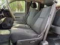 A 2013 Chevrolet Silverado 3500HD featuring fabric upholstery with three front seats and seatbelts visible in the interior
