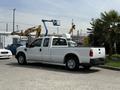A white 2008 Ford F-250 SD pickup truck parked on a concrete surface with a flatbed and regular cab design
