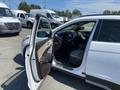A white 2018 Hyundai Santa Fe with an open driver's side door revealing the interior and front seats