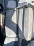 A 2013 Larson 238 boat seat featuring a gray upholstery design with the Larson logo visible on one of the cushions