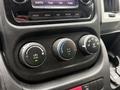 Controls for air conditioning and ventilation system in a 2020 RAM Promaster with circular dials and a digital display panel above