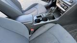 Interior view of a 2018 Hyundai Sonata showing front seats center console and gear shift with cup holders