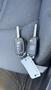 Two automotive keys for a 2018 Hyundai Sonata with a key fob design and a tag attached