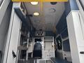 Interior of a 2020 Mercedes-Benz Sprinter 2500 with a spacious layout featuring storage compartments and a driver's seat
