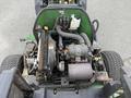 Aerial view of a 2009 John Deere 2653B Precision engine compartment showing the engine components and wiring setup with various mechanical parts visible