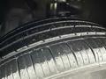 Close-up of a brand new tire showing deep tread and clean rubber surface on a 2016 Mercedes-Benz GLA-250