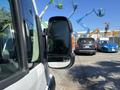 Side view mirror of a 2020 RAM ProMaster 3500 showing reflective surface and design features