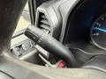 Close-up of a 2019 Ford F-350 SD steering column featuring the turn signal lever and vehicle control buttons