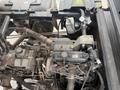 Close-up view of the engine compartment of a 2011 Kubota RTV 1140 CPX showcasing various mechanical components and wiring